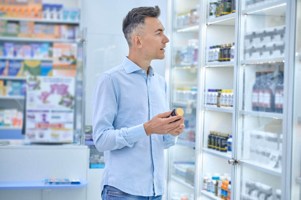 choosing medicines man choosing medicines na drugstore